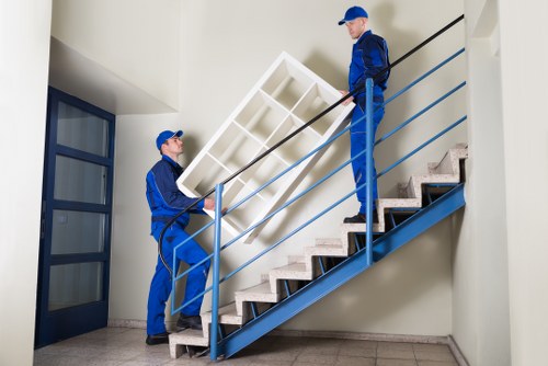 Furniture being moved from a modern Docklands flat during a house removal
