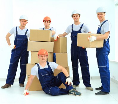 Local man with van loading furniture in Docklands apartment area