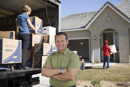 Removal truck and movers managing access in Docklands
