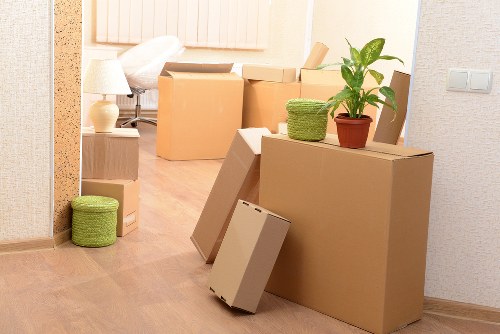 Packed moving boxes and furniture ready for Docklands relocation