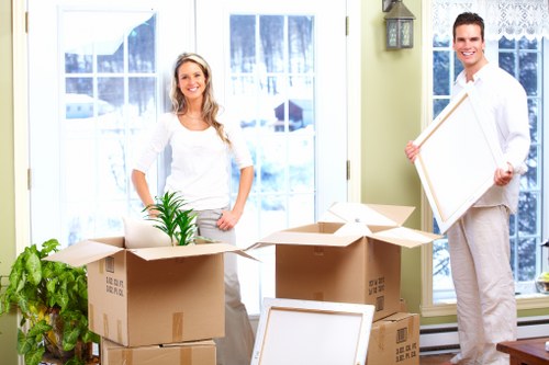 Packing boxes and moving equipment ready for a Docklands move